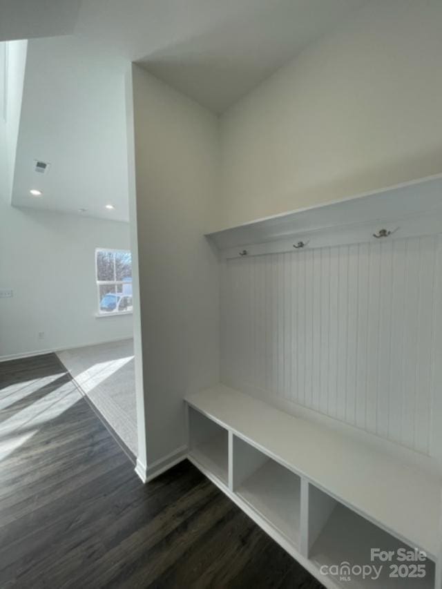 mudroom with dark hardwood / wood-style floors