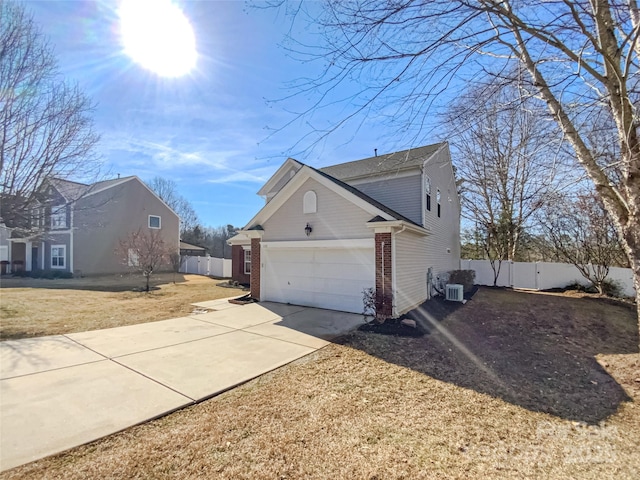 view of side of home with a garage