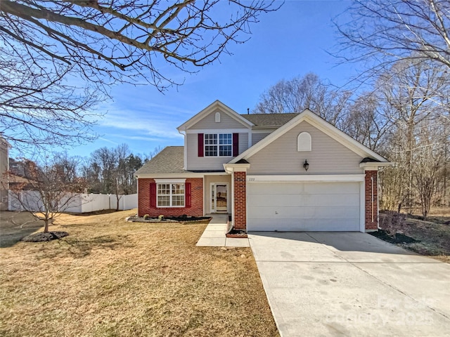 view of front of property featuring a garage and a front yard