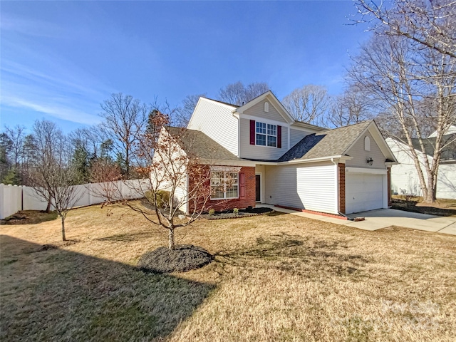 view of property with a garage and a front yard