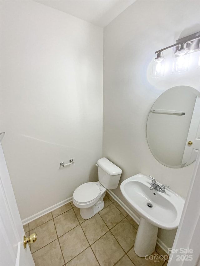 bathroom featuring tile patterned floors and toilet