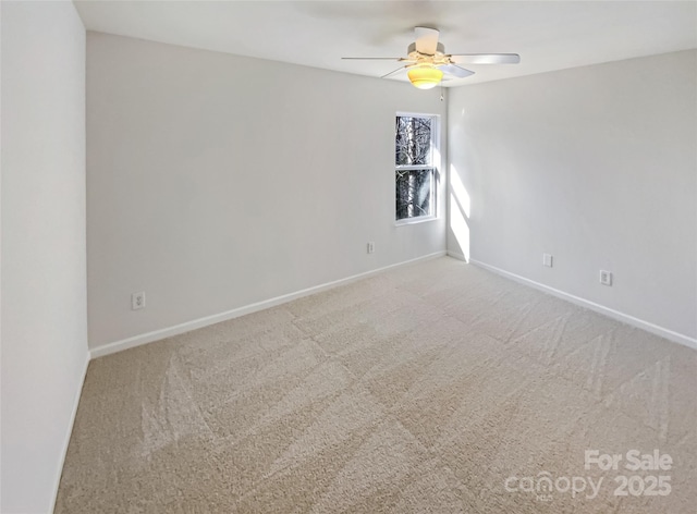 empty room with carpet floors and ceiling fan