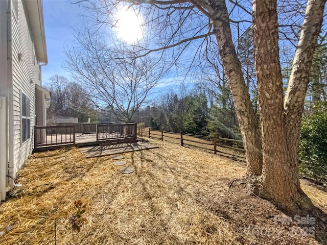 view of yard with a wooden deck