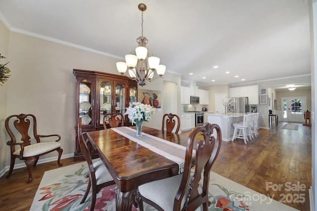 dining area with a notable chandelier, crown molding, and dark wood-type flooring