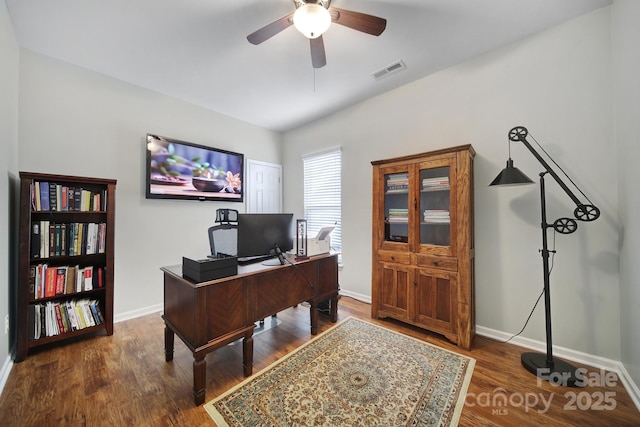 office area featuring dark wood-type flooring and ceiling fan