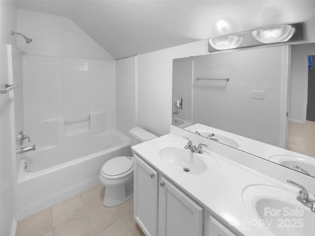 full bathroom with lofted ceiling, tub / shower combination, tile patterned flooring, vanity, and toilet