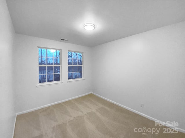 spare room with carpet flooring