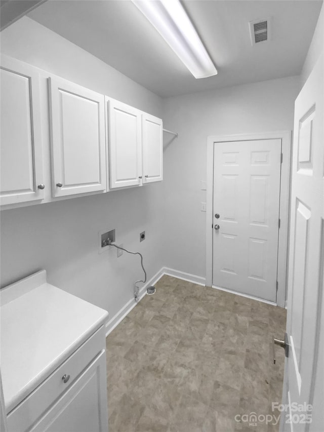 laundry area with cabinets, hookup for an electric dryer, and washer hookup