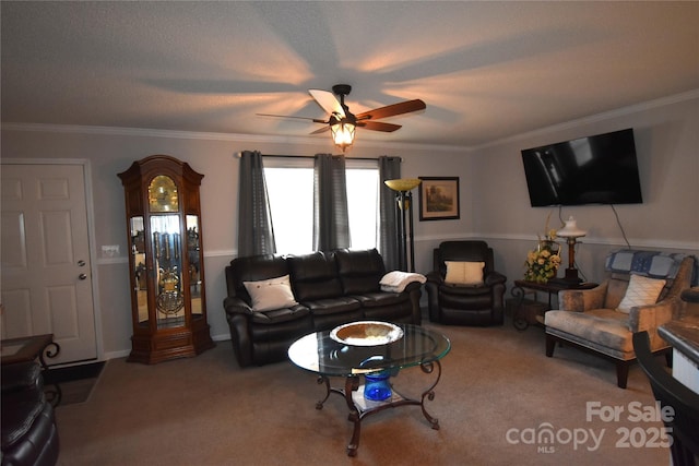 carpeted living room with crown molding and ceiling fan