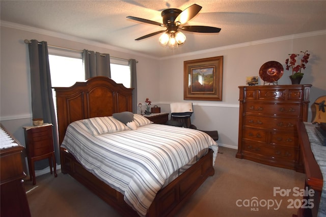 carpeted bedroom featuring crown molding and ceiling fan