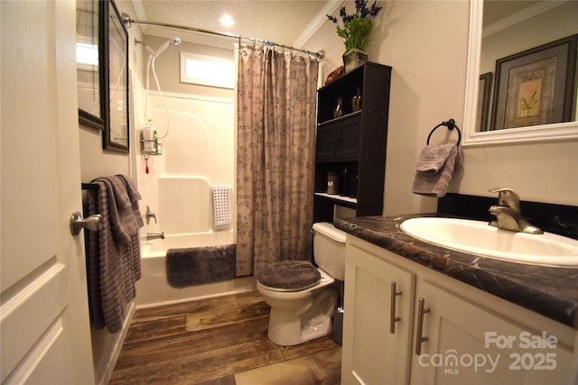 full bathroom with hardwood / wood-style flooring, ornamental molding, vanity, toilet, and shower / bath combo