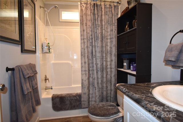 bathroom with shower / bathtub combination with curtain, vanity, and toilet