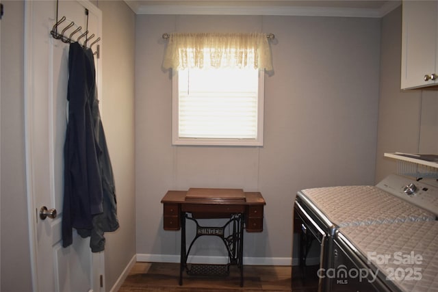 washroom featuring dark wood finished floors, washing machine and clothes dryer, baseboards, and ornamental molding
