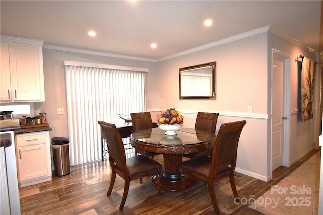 dining area with recessed lighting, dark wood-style flooring, baseboards, and crown molding