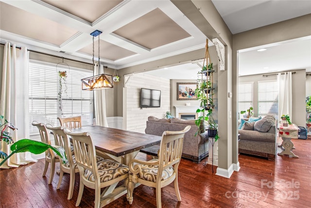 dining area featuring coffered ceiling and dark hardwood / wood-style flooring