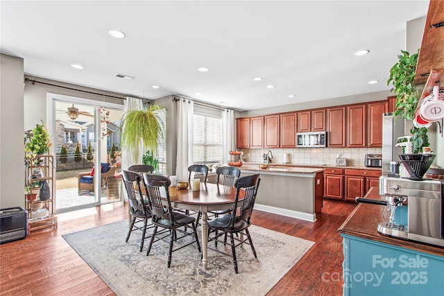 dining space featuring sink and dark hardwood / wood-style floors