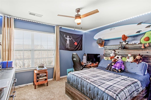 carpeted bedroom with ceiling fan