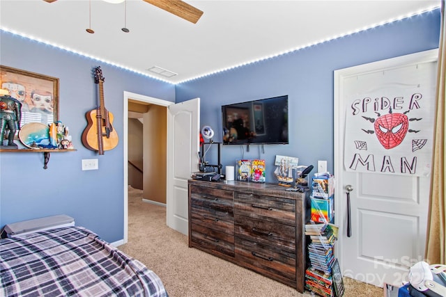 carpeted bedroom with ceiling fan