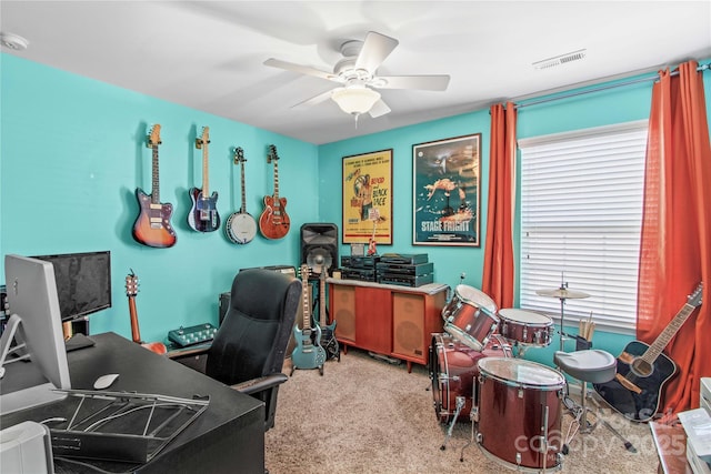 office space with light colored carpet and ceiling fan