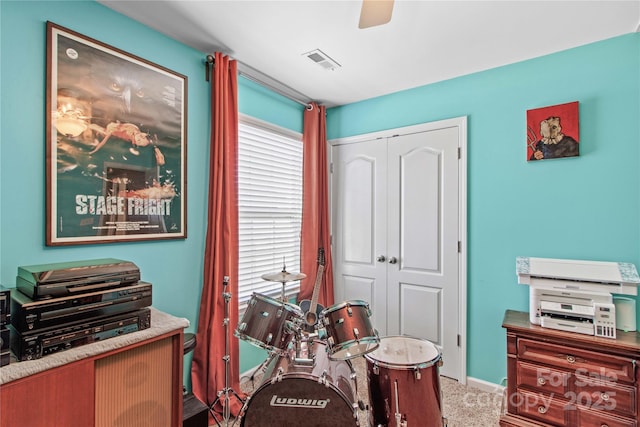 recreation room with carpet flooring and ceiling fan