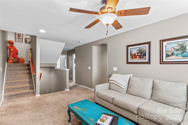 living room featuring carpet floors and ceiling fan