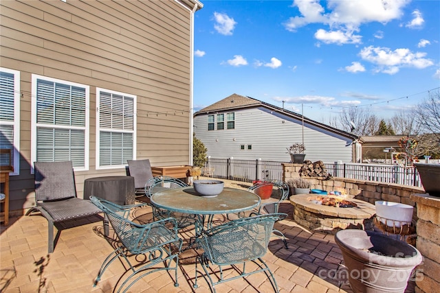 view of patio with an outdoor fire pit