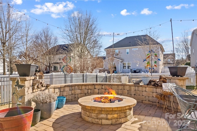 view of patio / terrace with an outdoor fire pit