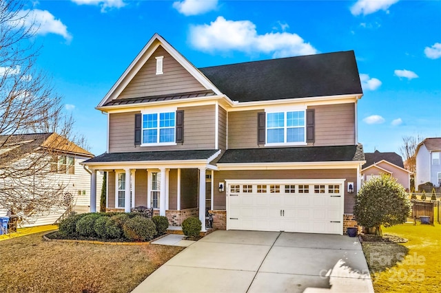 craftsman inspired home with a garage and a porch