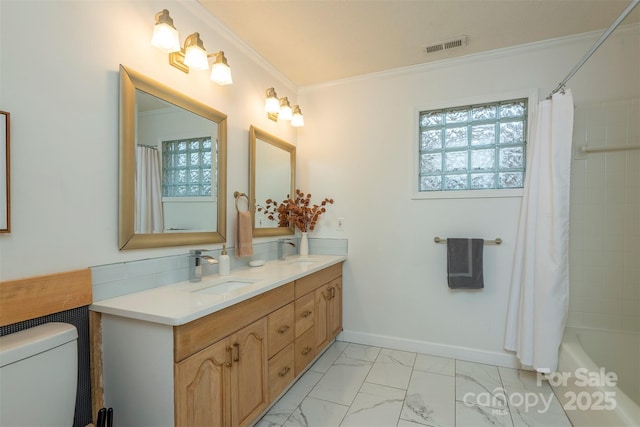 full bathroom with vanity, crown molding, toilet, and shower / bath combo