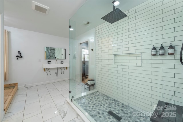 bathroom with a tile shower