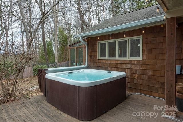 deck with a hot tub