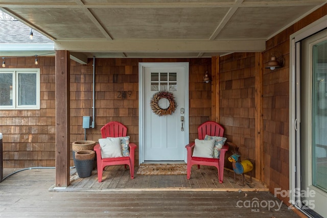 property entrance with a deck