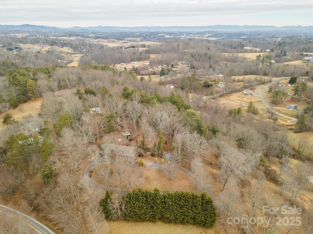 bird's eye view featuring a mountain view and a rural view