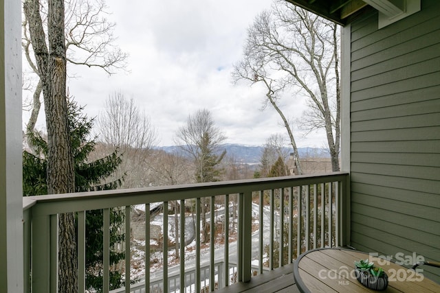 wooden deck featuring a mountain view