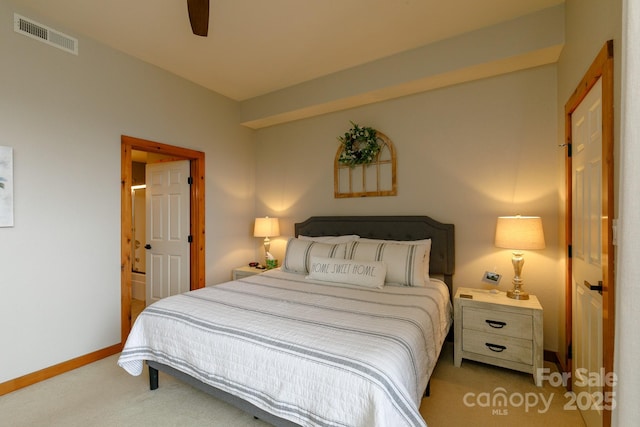 bedroom featuring light colored carpet and ceiling fan