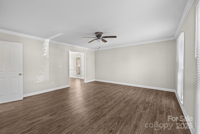 empty room featuring dark wood-type flooring, ceiling fan, and crown molding