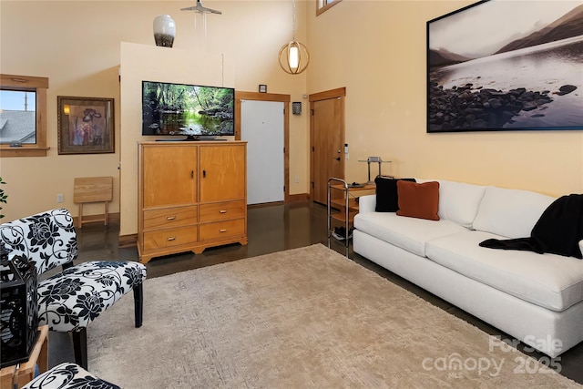 living room featuring a high ceiling