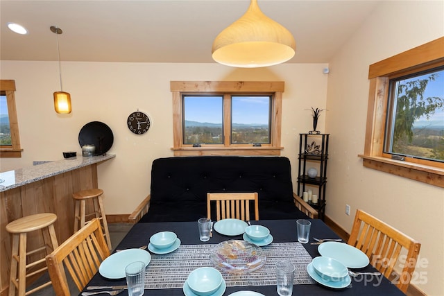 dining space featuring bar area