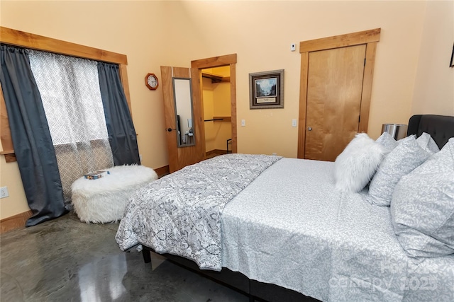 bedroom with lofted ceiling and a closet