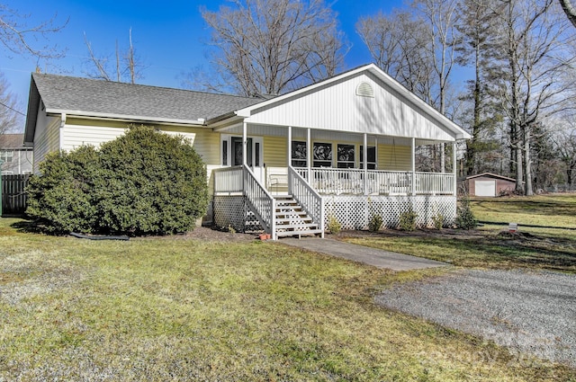 view of front of home with a front lawn and covered porch