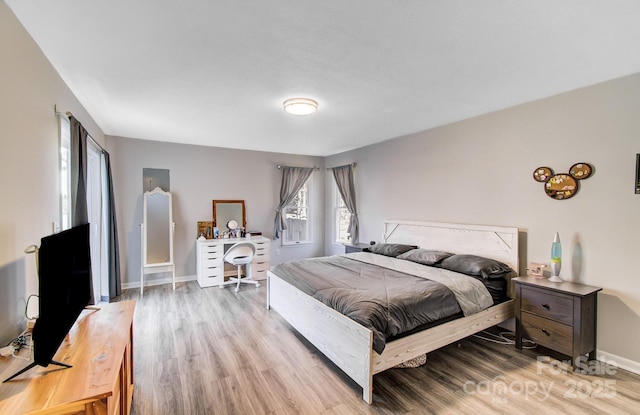 bedroom with light wood-type flooring