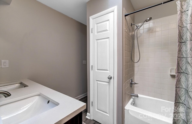 bathroom featuring shower / tub combo with curtain and vanity