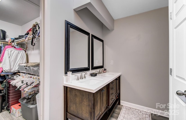 bathroom featuring vanity and hardwood / wood-style flooring