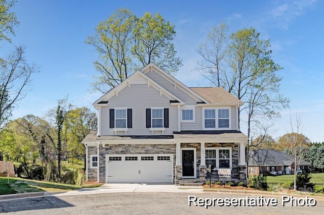 craftsman house with a garage and covered porch