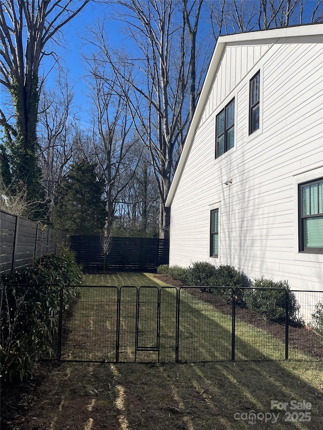 view of yard with fence private yard and a gate