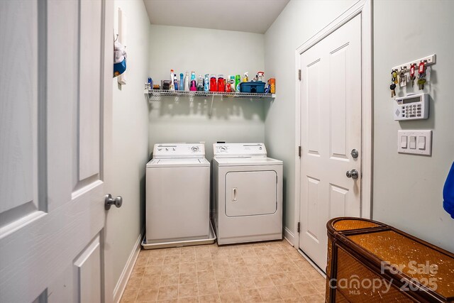 washroom featuring washing machine and dryer