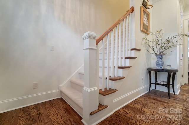 stairs with wood-type flooring