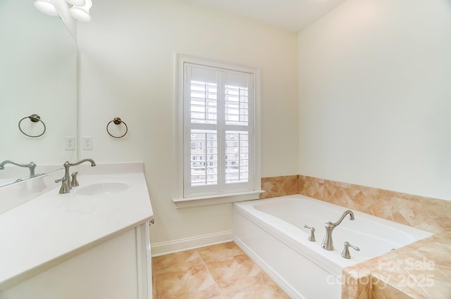 bathroom featuring vanity, tile patterned flooring, and a bathtub