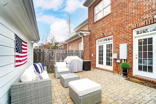 view of patio / terrace featuring french doors, grilling area, and an outdoor hangout area