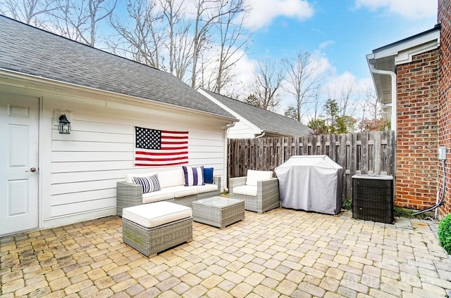 view of patio / terrace featuring an outdoor living space, a grill, and central AC